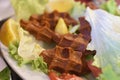 Turkish cigkofte and lemon on lettuce, lettuce, parsley, mint