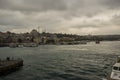 Istanbul, Turkey: view of the bridge and tourist ships in cloudy weather. The Suleymaniye Mosque Royalty Free Stock Photo