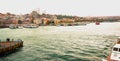 Istanbul, Turkey: view of the bridge and tourist ships in cloudy weather. The Suleymaniye Mosque Royalty Free Stock Photo