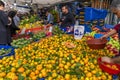 Istanbul, Turkey 11/19/2019 View of a market vendor with a stall full of fresh fruit, there are oranges, tomatoes, apples, bananas