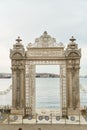 Istanbul, Turkey - 05.05.2021: View over the Dolmabahce gate in the eponymous palace. Royalty Free Stock Photo