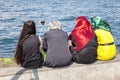 Istanbul, Turkey, 07.25.2015: Women in bright oriental clothes take selfies. Back view. Muslim country