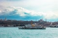 Istanbul view. Ferry and cityscape of Istanbul with dramatic clouds