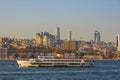 Istanbul view. Ferry and cityscape of Istanbul at sunset.