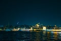 Istanbul view at night. Crescent moon and Suleymaniye Mosque with Galata Bridge