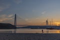 istanbul yavuz sultan selim bridge taken from the beach towards sunset people dogs Royalty Free Stock Photo