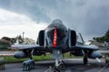 Istanbul, Yesilkoy - Turkey - 04.20.2023: F-4 Phantom Fighter Jet Plane, Supersonic jet Fighter and Bomber. Dark Clouds Background