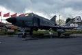 Istanbul, Yesilkoy - Turkey - 04.20.2023: F-4 Phantom Fighter Jet Plane, Supersonic jet Fighter and Bomber. Dark Clouds Background