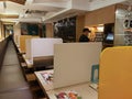 4 3 2021 Itacho Sushi, a Japanese restaurant, with table Of plastic shield partition to keep social distance during covid-19 in