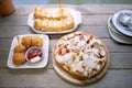 Italain pizza ,chicken ball and bread butter sungar on top read to eaton wood table