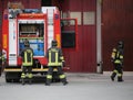 Italia, IT, Italy - May 10, 2018: big fire truck and three talian firefighters with uniform during fire drill Royalty Free Stock Photo