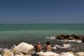 Italian adriatic coastline landscape people on the rocks