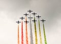 Italian aerobatics team in formation deploying smoke Royalty Free Stock Photo