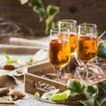 Italian almond liquor amaretto on a wooden table Royalty Free Stock Photo