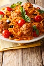 Italian American pasta spaghetti with meat balls, vegetables in Royalty Free Stock Photo