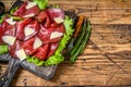 Italian Antipasti Bresaola meat cut with green salad and Parmesan. wooden background. Top view. Copy space Royalty Free Stock Photo