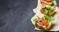 Italian antipasti crostini with ham, salad and tomato Royalty Free Stock Photo