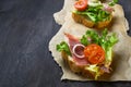 Italian antipasti crostini with ham, salad and tomato Royalty Free Stock Photo