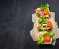 Italian antipasti crostini with ham, salad and tomato Royalty Free Stock Photo