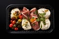 Italian Antipasti Set with Small Peppers Stuffed with Cream Cheese, Pickled Olives, Marinated Mushrooms,