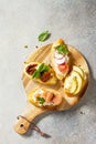 Italian Antipasti snacks set for Wine. Brushetta with Soft Cheese, Pear, Radish, Salmon and Dried Tomatoes Royalty Free Stock Photo