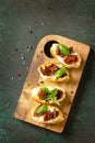 Italian Antipasti snacks for Wine. Brushetta with Soft Cheese and Dried Tomatoes Royalty Free Stock Photo