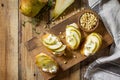 Italian Antipasti snacks for Wine. Brushetta with Soft Cheese, Pear and Pine Nuts Royalty Free Stock Photo