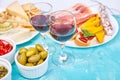 Italian antipasti wine snacks set. Brushettas on blue background