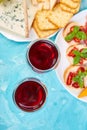Italian antipasti wine snacks set. Brushettas on blue background