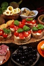 Italian antipasti wine snacks set. Cheese variety, Mediterranean olives, pickles, Prosciutto di Parma, tomatoes, artichokes Royalty Free Stock Photo