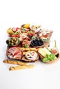 Italian antipasti wine snacks set. Cheese variety, Mediterranean olives, pickles, Prosciutto di Parma, tomatoes, artichokes Royalty Free Stock Photo