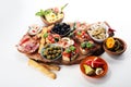 Italian antipasti wine snacks set. Cheese variety, Mediterranean olives, pickles, Prosciutto di Parma, tomatoes, artichokes Royalty Free Stock Photo