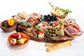 Italian antipasti wine snacks set. Cheese variety, Mediterranean olives, pickles, Prosciutto di Parma, tomatoes, artichokes Royalty Free Stock Photo