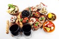 Italian antipasti wine snacks set. Cheese variety, Mediterranean olives, pickles, Prosciutto di Parma, tomatoes, artichokes and Royalty Free Stock Photo