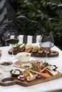 Italian antipasti wine snacks on table, outdoor party Royalty Free Stock Photo