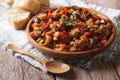 Italian appetizer Caponata close-up on a wooden plate. Horizonta