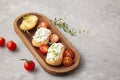 Italian appetizer toasted bread bruschetta with cream chease and tomatoes Royalty Free Stock Photo