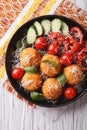 Italian arancini rice balls with cheese close-up. vertical top v