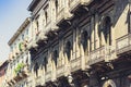 Italian background. Historical street of Catania, Sicily, facade of old building