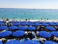 Blue umbrellas on the beach of Italy
