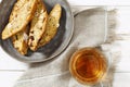 Italian biscotti cookies in grey plate and sweet wine Vin Santo. Fresh baked cookies with nuts Royalty Free Stock Photo