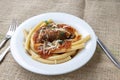 Italian braciole served with bucatini pasta Royalty Free Stock Photo