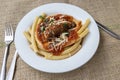 Italian braciole served with bucatini pasta Royalty Free Stock Photo