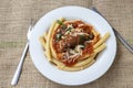 Italian braciole served with bucatini pasta Royalty Free Stock Photo