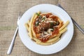 Italian braciole served with bucatini pasta Royalty Free Stock Photo