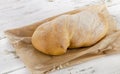 Italian bread ciabatta on wooden table. Royalty Free Stock Photo