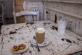 Italian breakfast at the cafe bar with latte macchiato spotted milk and small pastries