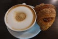 Italian breakfast with a cappuccino, brown sugar and a fresh croissant