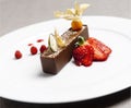 Italian brown chocolate dessert with strawberry red