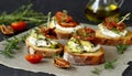 Italian bruschetta bread with cream cheese, zucchini and dried tomato with herbs. Canape with ricotta cheese